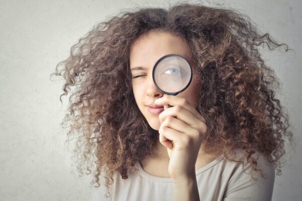 Career365.com.au_Career Clarity_girl looking into a magnifying glass